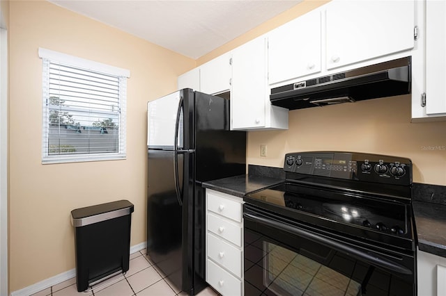 kitchen featuring white cabinets, dark stone countertops, light tile patterned floors, and black appliances