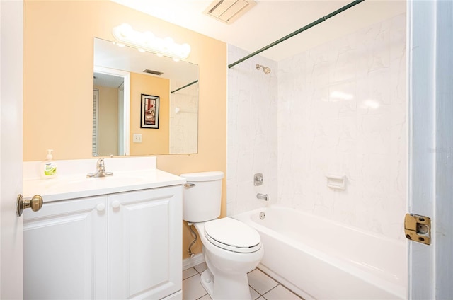 full bathroom featuring tiled shower / bath, vanity, toilet, and tile patterned flooring