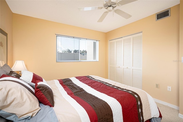 bedroom featuring carpet floors, a closet, and ceiling fan