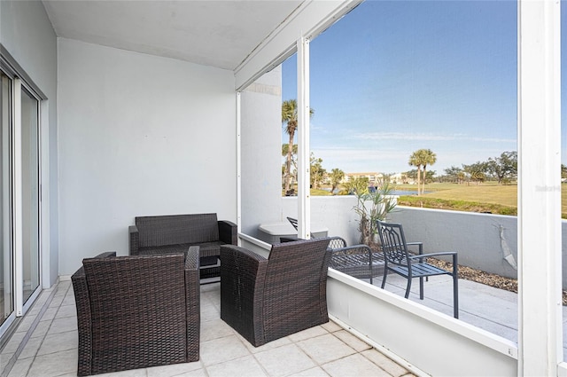 view of patio with a balcony and an outdoor hangout area