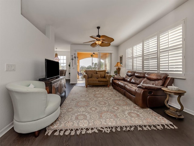 living room with hardwood / wood-style flooring and ceiling fan