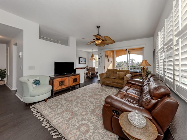 living room with ceiling fan and wood-type flooring