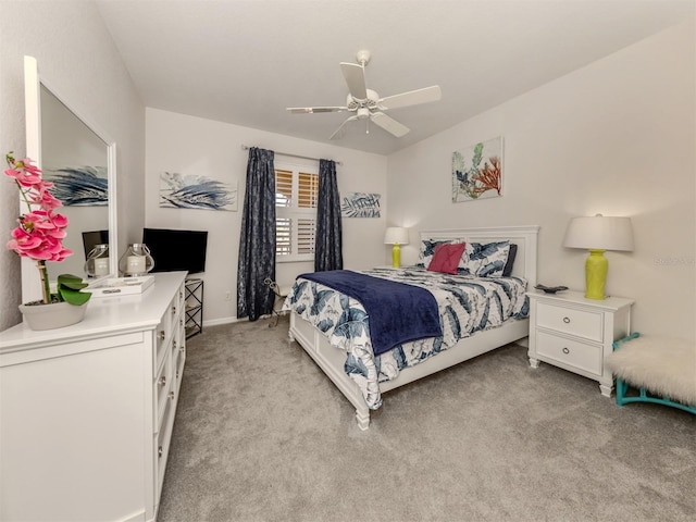 bedroom featuring ceiling fan and light colored carpet