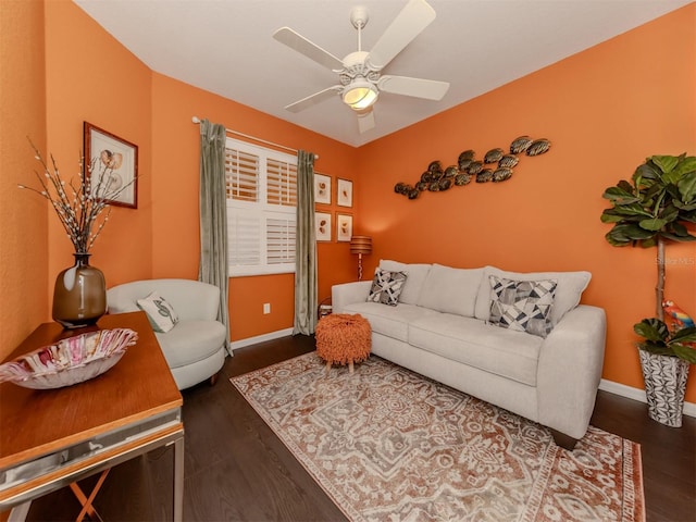 living room with ceiling fan and dark hardwood / wood-style floors