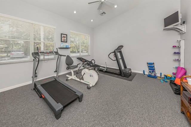 exercise area featuring ceiling fan and lofted ceiling