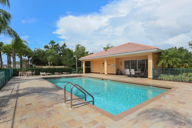 view of swimming pool with a patio area