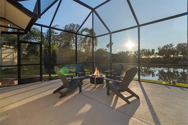 unfurnished sunroom featuring a water view