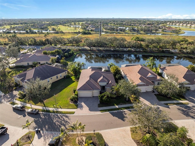 aerial view with a water view and a residential view