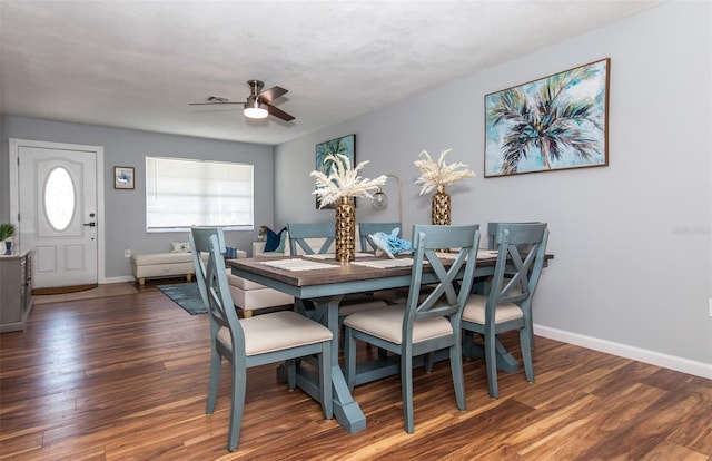 dining area featuring dark hardwood / wood-style flooring and ceiling fan