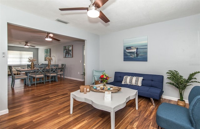 living room with dark hardwood / wood-style flooring