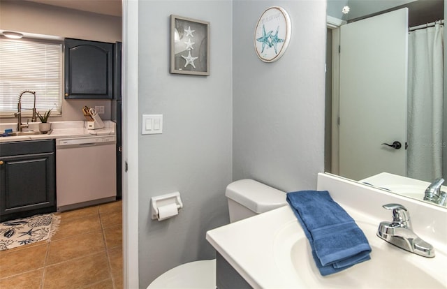 bathroom with tile patterned floors, vanity, and toilet