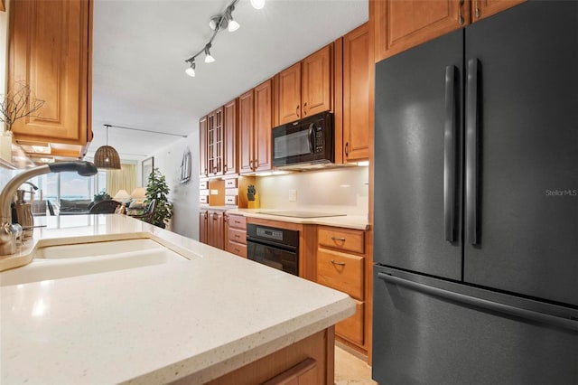 kitchen with sink and black appliances