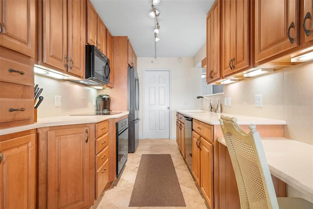 kitchen featuring sink and black appliances