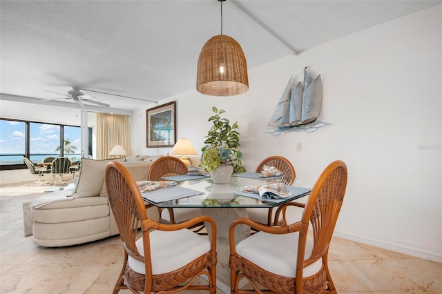 dining space featuring ceiling fan