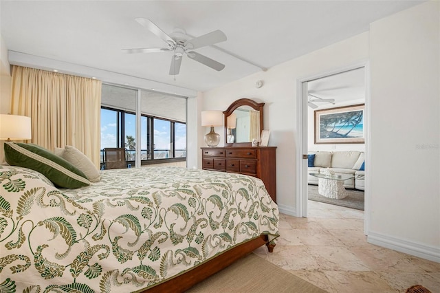 bedroom featuring expansive windows, ceiling fan, and access to exterior