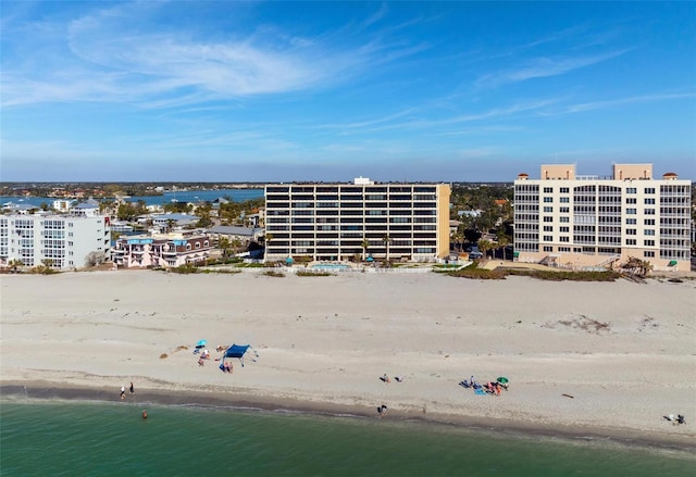 drone / aerial view featuring a water view and a beach view