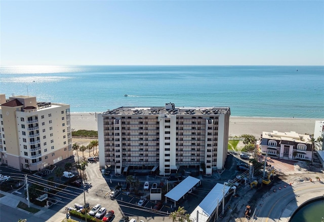 bird's eye view featuring a water view and a view of the beach