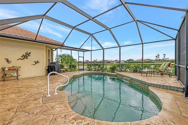 view of swimming pool featuring a lanai, grilling area, and a patio