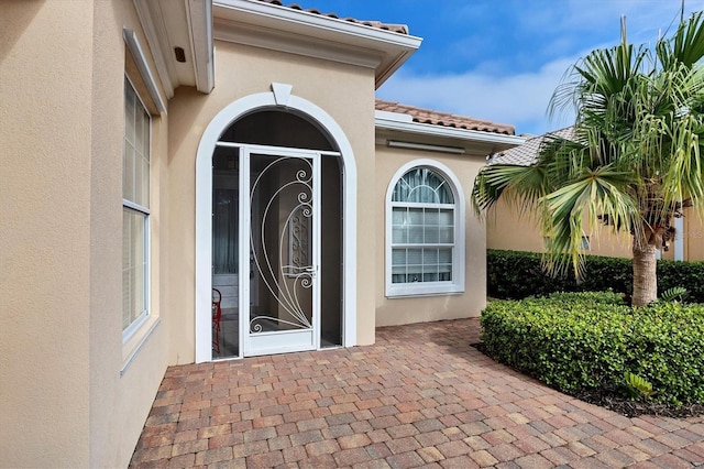 doorway to property featuring a patio area