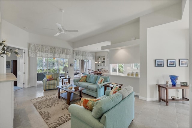 tiled living room featuring ceiling fan