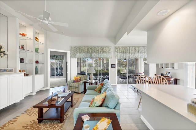 living room featuring ceiling fan, light tile patterned floors, and built in features