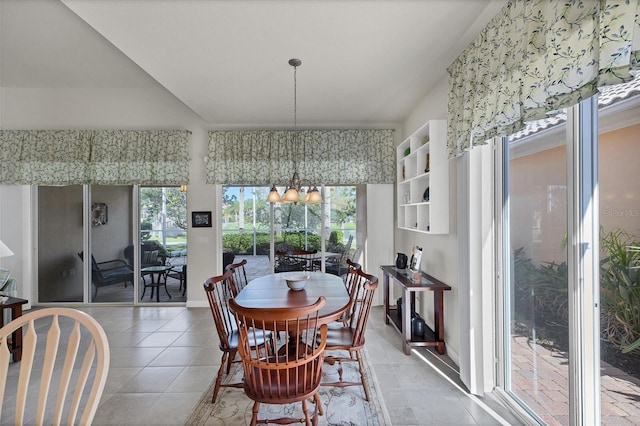 dining area featuring a chandelier and light tile patterned floors