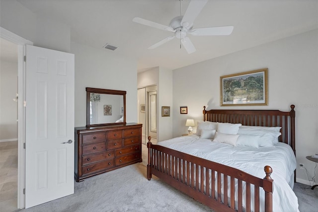 carpeted bedroom featuring a closet and ceiling fan