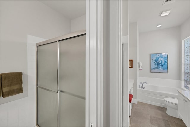 full bathroom featuring vanity, toilet, shower with separate bathtub, and tile patterned flooring