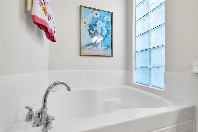 bathroom with a tub