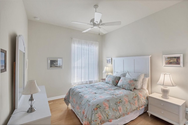 bedroom with light wood-type flooring and ceiling fan