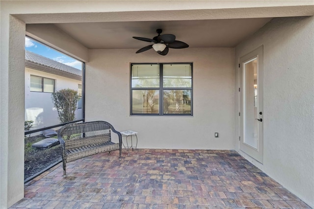 view of patio / terrace with an outdoor living space and ceiling fan