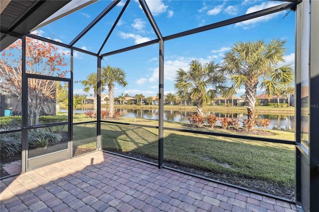 unfurnished sunroom with a water view