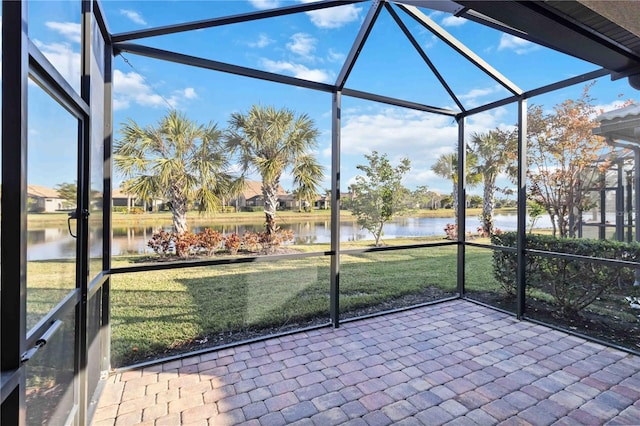 unfurnished sunroom with a water view