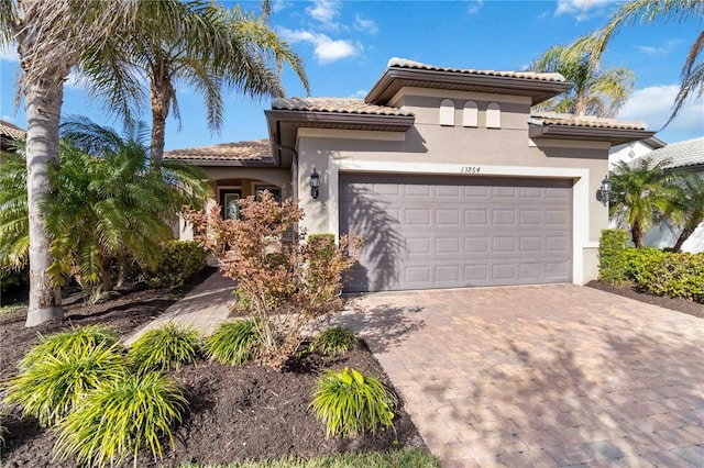 mediterranean / spanish house featuring a garage