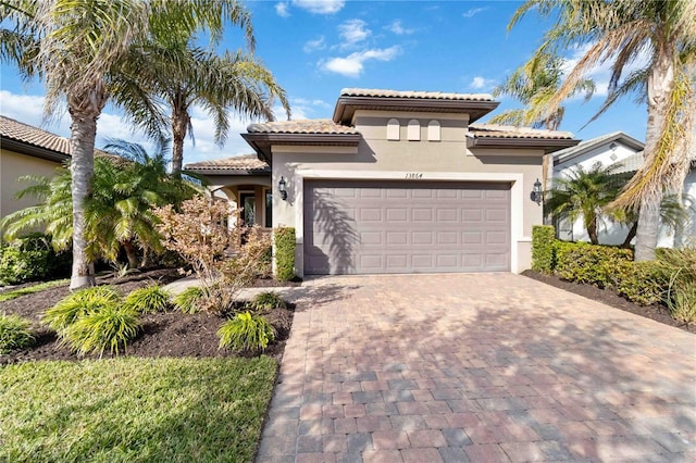 mediterranean / spanish home featuring a garage