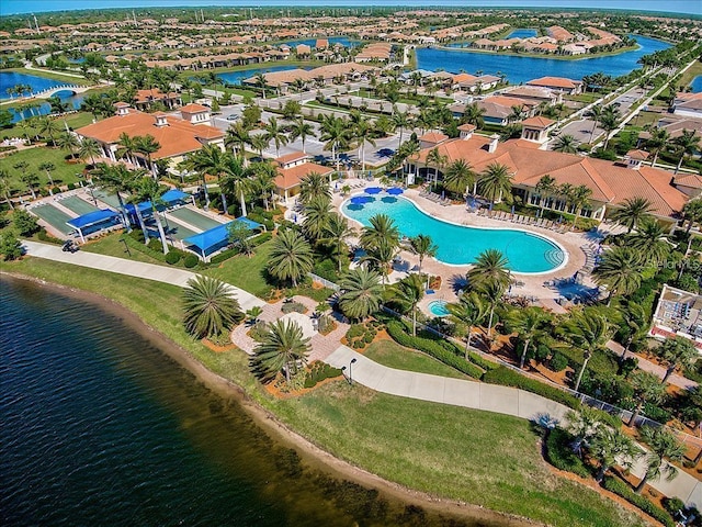 birds eye view of property with a water view