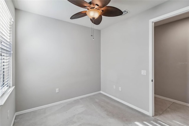 spare room with ceiling fan and a healthy amount of sunlight