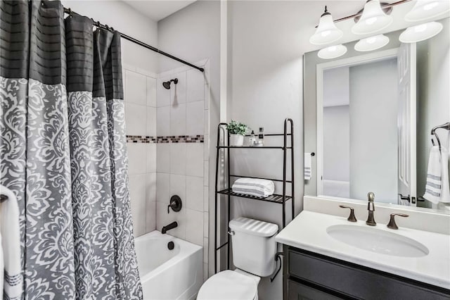 full bathroom featuring vanity, toilet, and shower / tub combo