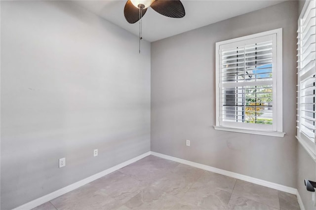 spare room with ceiling fan