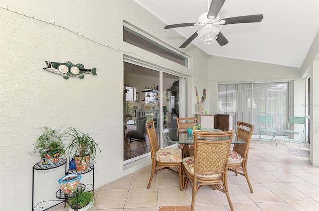 sunroom featuring lofted ceiling and ceiling fan