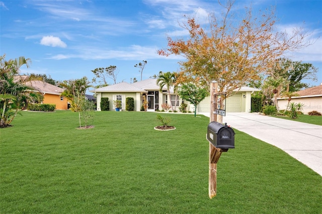 view of front of house featuring a garage and a front yard