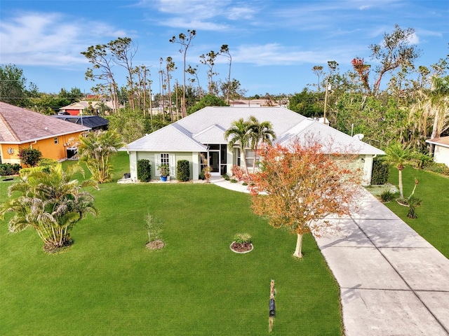 ranch-style home featuring a front lawn