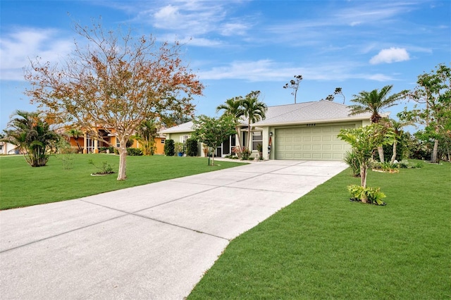 ranch-style house with a garage and a front lawn