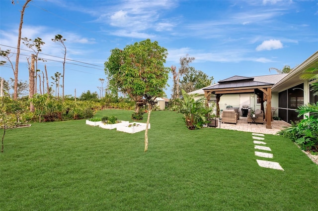 view of yard with a gazebo and a patio area