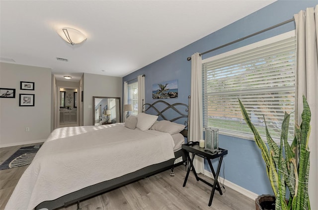 bedroom featuring light hardwood / wood-style floors