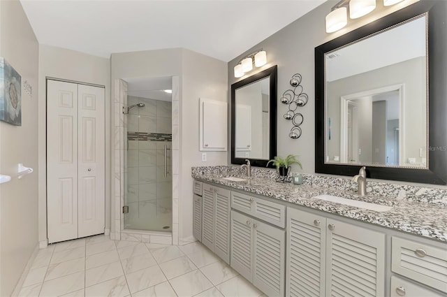 bathroom with vanity and a shower with shower door