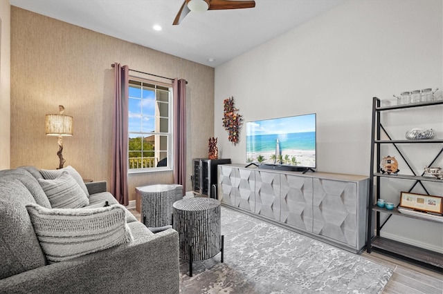 living room with hardwood / wood-style flooring and ceiling fan