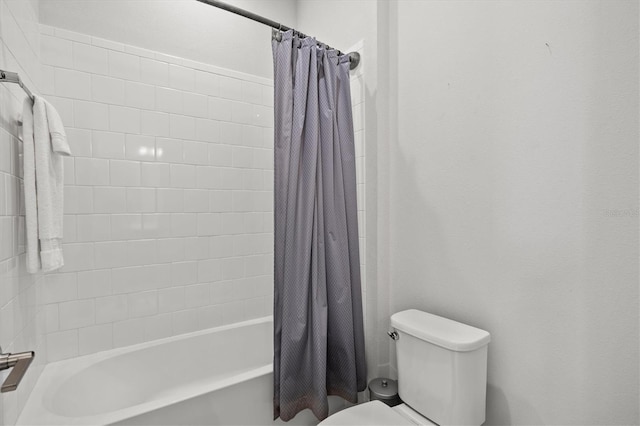 bathroom with toilet and shower / bath combo