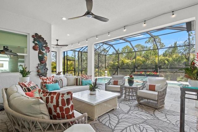 view of patio / terrace with outdoor lounge area, ceiling fan, and a lanai