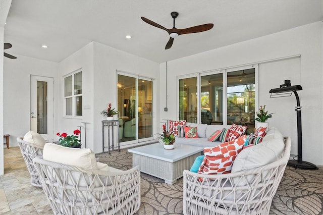 view of patio with ceiling fan and an outdoor living space